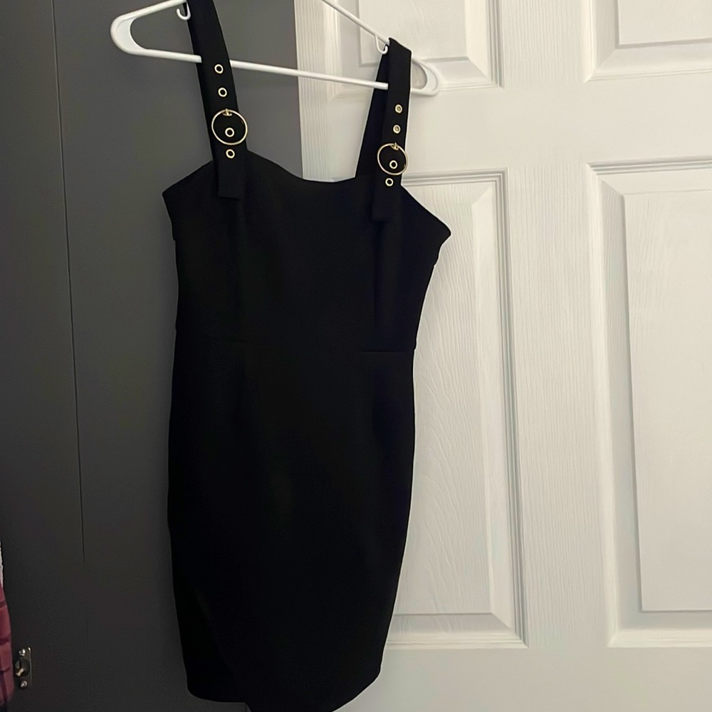 Black suede cocktail dress with gold buckle straps